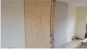 Supporting existing wall with plywood